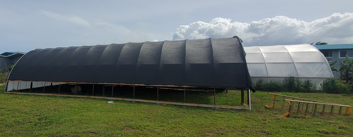 Greenhouse protected by fitted shade cloth